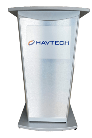 A modern, metallic podium with an inclined front face featuring the Havtech logo, which includes the text "HAVTECH" and an abstract orange and blue swoosh symbol. The podium is sleek and minimalist in design.